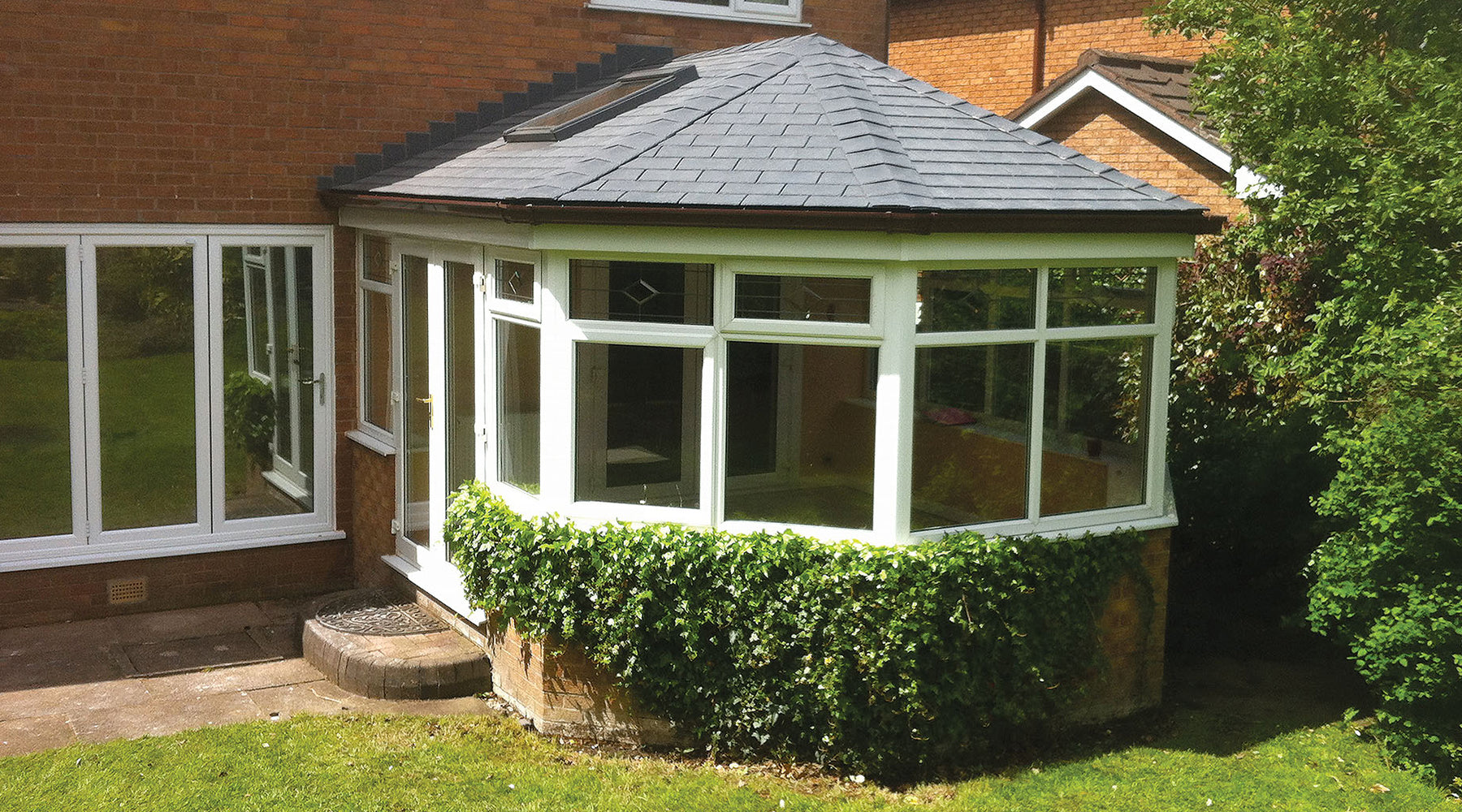 Grey Tapco Slate installed on a tiled conservatory roof